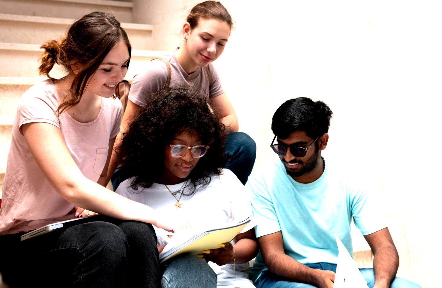 Students working on web development projects in a modern learning environment